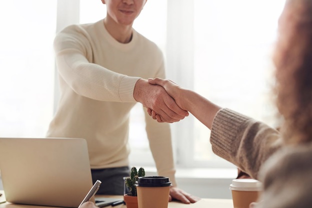 People shaking hands after a business meeting.